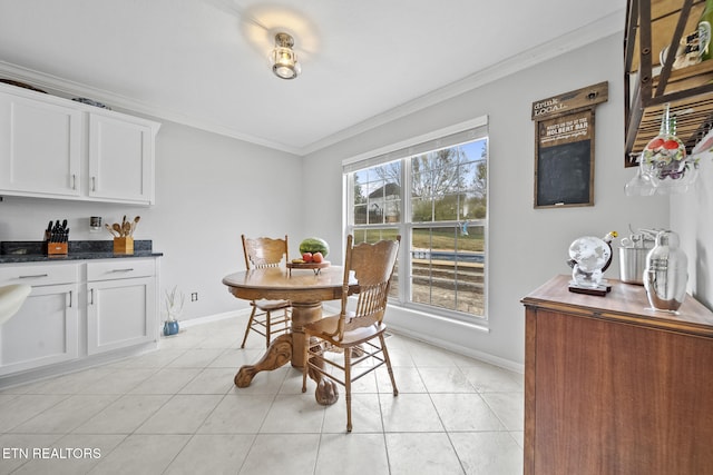 dining space with light tile patterned flooring and crown molding