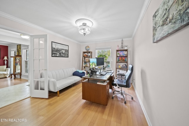 office with french doors, hardwood / wood-style floors, ornamental molding, and a notable chandelier