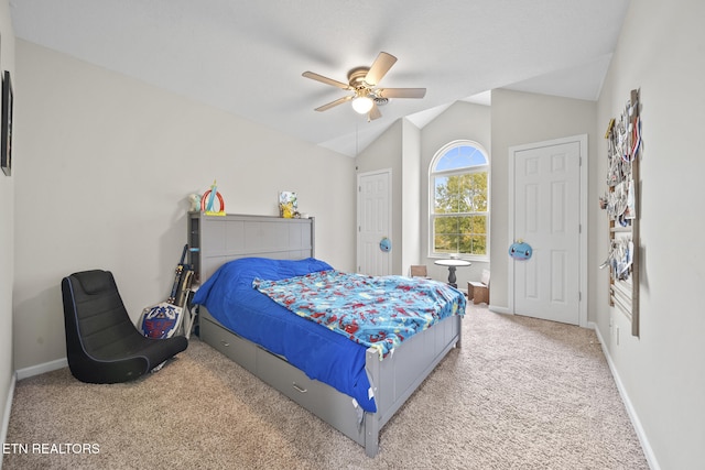 carpeted bedroom with lofted ceiling and ceiling fan