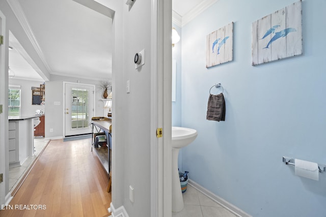 bathroom featuring hardwood / wood-style floors and crown molding