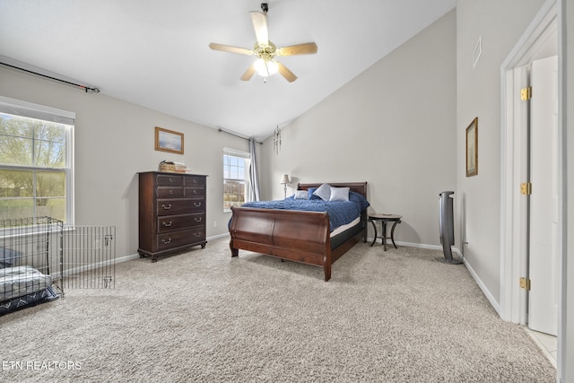 bedroom featuring light colored carpet, multiple windows, and ceiling fan