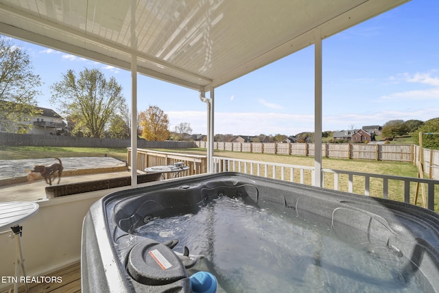 unfurnished sunroom featuring a jacuzzi