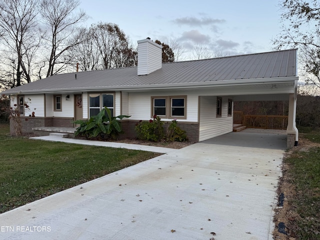 ranch-style house with a front lawn and a carport