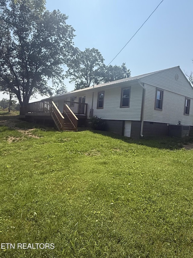 1184 Davis Chapel Rd, Lafollette, TN 37766 - rear view of house featuring a lawn, a deck, and stairway