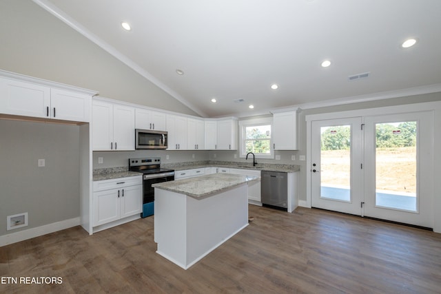 6105 Lanier Rd, Maryville, TN 37801 - kitchen featuring appliances with stainless steel finishes, a sink, white cabinets, vaulted ceiling, and recessed lighting