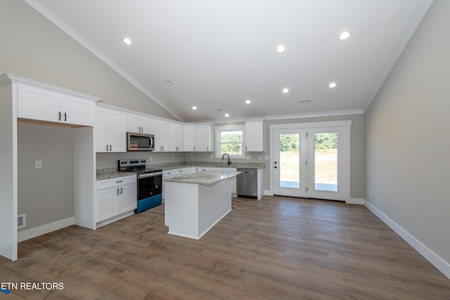 6105 Lanier Rd, Maryville, TN 37801 - kitchen with appliances with stainless steel finishes, a center island, white cabinetry, dark wood-style floors, and recessed lighting