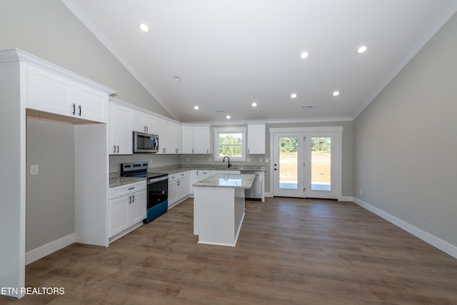 6105 Lanier Rd, Maryville, TN 37801 - kitchen with appliances with stainless steel finishes, white cabinetry, a center island, a sink, and ornamental molding
