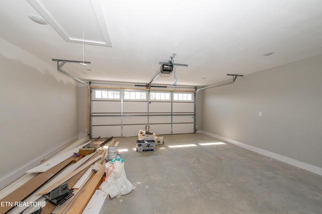 6105 Lanier Rd, Maryville, TN 37801 - garage featuring a garage door opener and baseboards