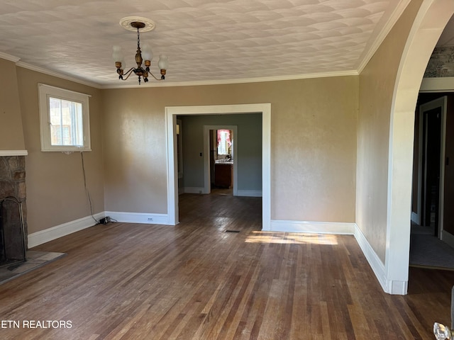 unfurnished dining area with ornamental molding, dark hardwood / wood-style flooring, and a notable chandelier