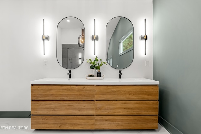 bathroom featuring vanity and a shower