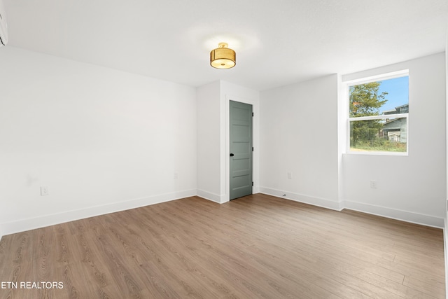 unfurnished room featuring light hardwood / wood-style flooring