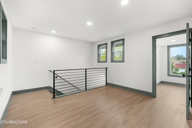 unfurnished room featuring light hardwood / wood-style floors