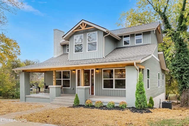 view of front of home featuring cooling unit and covered porch