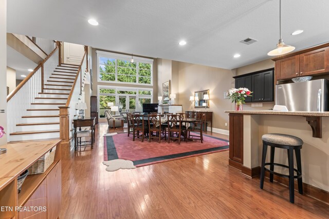 1144 Andalusian Way, Knoxville, TN 37922 - dining space featuring wood finished floors, stairs, baseboards, and recessed lighting