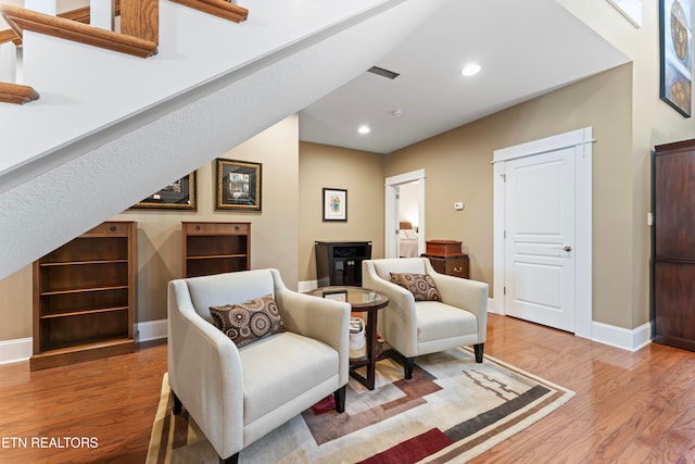 sitting room featuring wood-type flooring