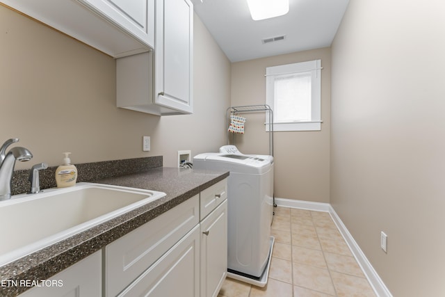 1144 Andalusian Way, Knoxville, TN 37922 - laundry room featuring cabinet space, light tile patterned floors, separate washer and dryer, and baseboards
