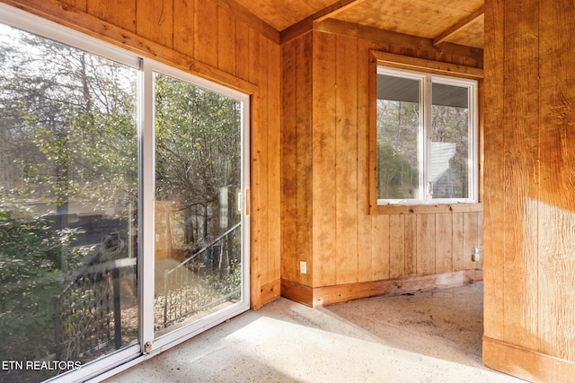 unfurnished sunroom featuring a healthy amount of sunlight