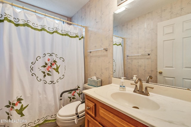 bathroom with a shower with curtain, vanity, and toilet