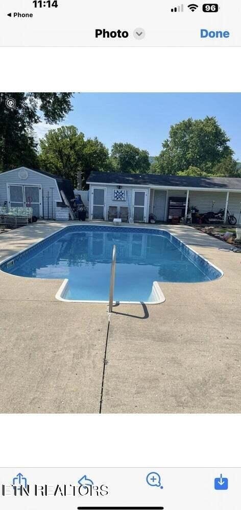 view of swimming pool featuring a patio area