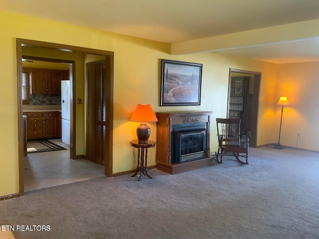 1315 Winchester Ave, Middlesboro, KY 40965 - living room featuring carpet, a glass covered fireplace, and baseboards