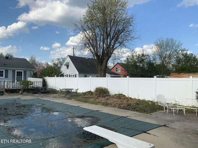 view of pool with a wooden deck