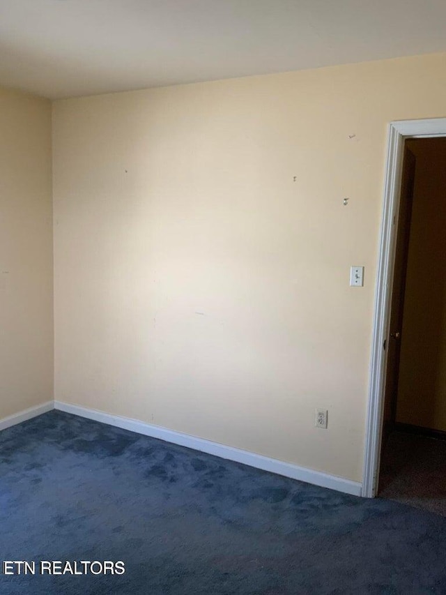 1315 Winchester Ave, Middlesboro, KY 40965 - unfurnished room with dark carpet and baseboards