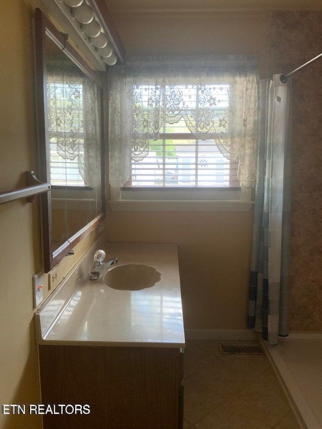 1315 Winchester Ave, Middlesboro, KY 40965 - full bath with vanity, tile patterned flooring, and a shower stall