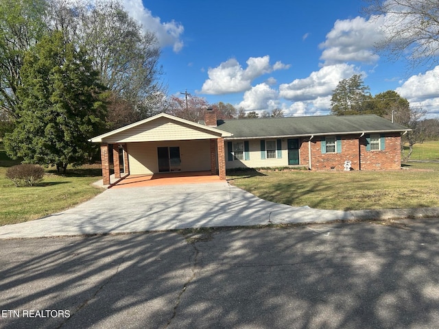 single story home featuring a carport and a front yard