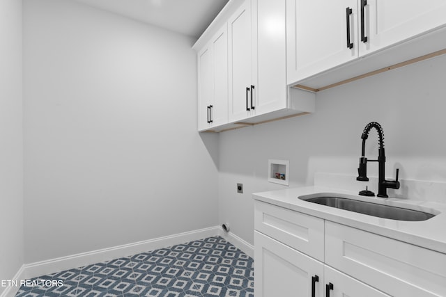 laundry room with cabinets, hookup for a washing machine, electric dryer hookup, and sink