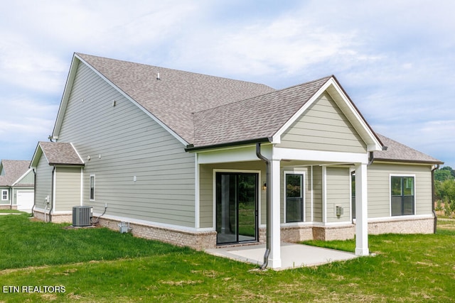 back of property featuring a lawn and a patio