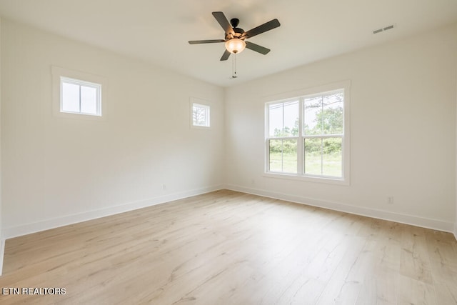 empty room featuring light wood-type flooring and ceiling fan