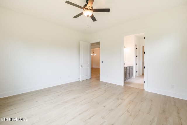 spare room featuring light hardwood / wood-style floors and ceiling fan