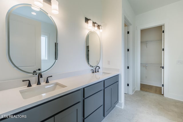 bathroom featuring tile patterned flooring and vanity