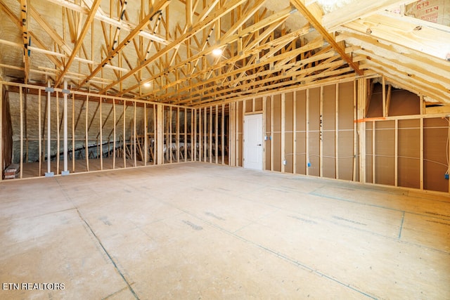 miscellaneous room with lofted ceiling