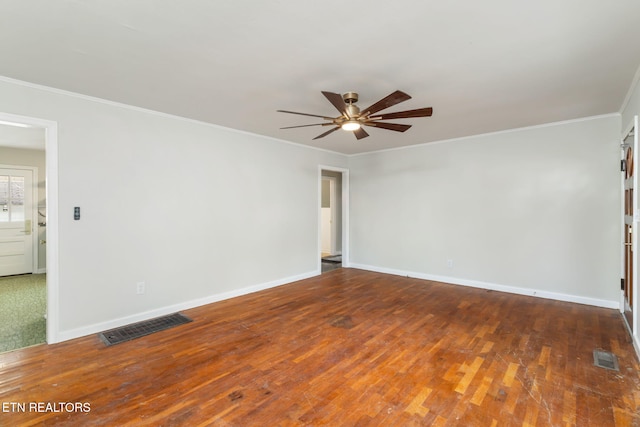 unfurnished room with ceiling fan, dark hardwood / wood-style floors, and ornamental molding