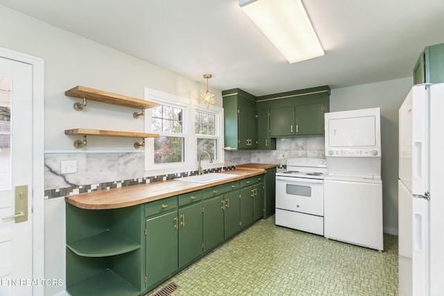 kitchen with butcher block countertops, backsplash, green cabinetry, sink, and white appliances