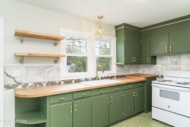 kitchen with white electric range, butcher block countertops, and green cabinets