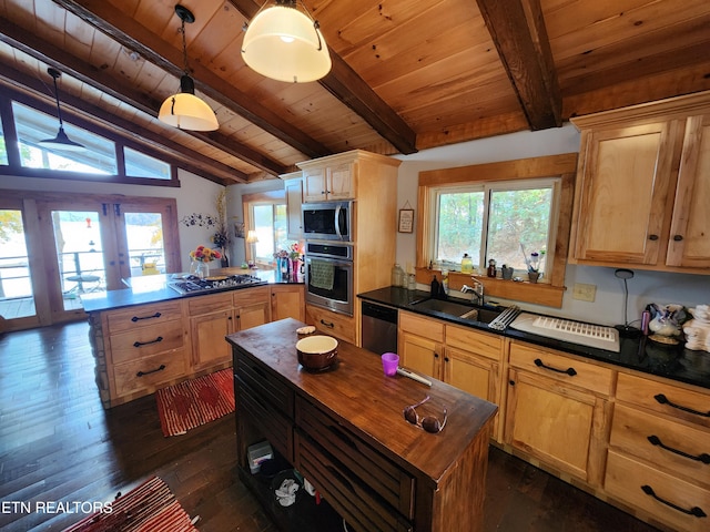 kitchen featuring stainless steel appliances, dark wood-type flooring, vaulted ceiling with beams, sink, and decorative light fixtures