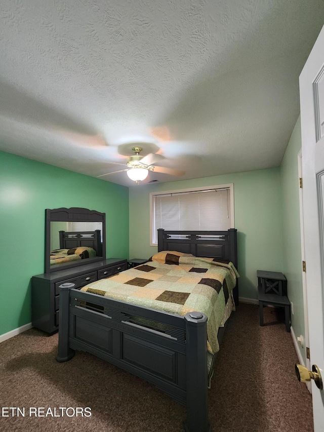 carpeted bedroom with ceiling fan and a textured ceiling