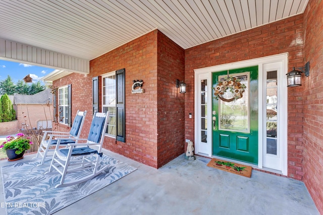 entrance to property featuring a porch