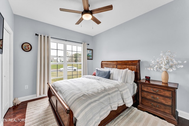 bedroom featuring ceiling fan and dark wood-type flooring