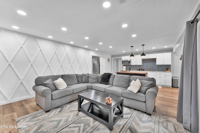 living room with light hardwood / wood-style flooring