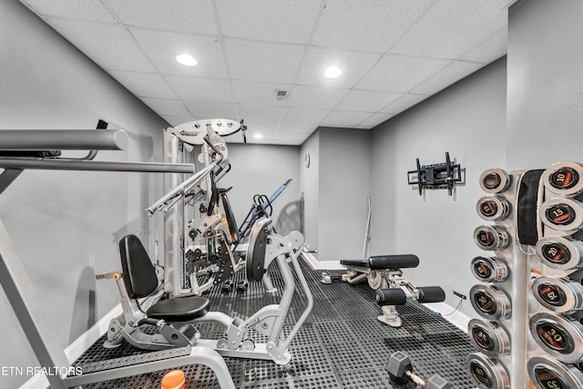 exercise area featuring a drop ceiling