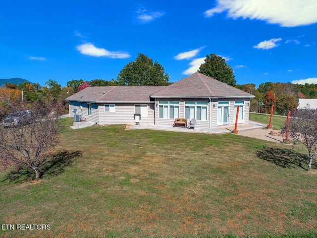 back of house with a patio, a lawn, and cooling unit