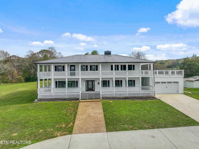view of front facade featuring a porch, a front yard, and a balcony