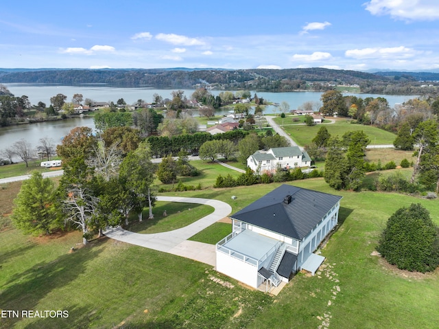 birds eye view of property with a water view
