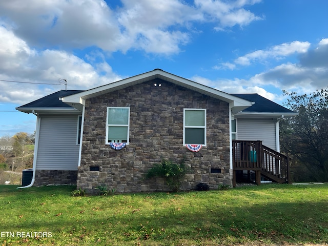 view of home's exterior with a lawn