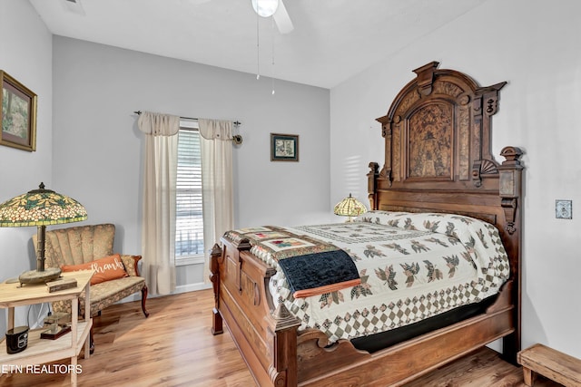 bedroom featuring ceiling fan and light hardwood / wood-style flooring