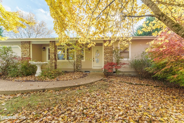 single story home with covered porch