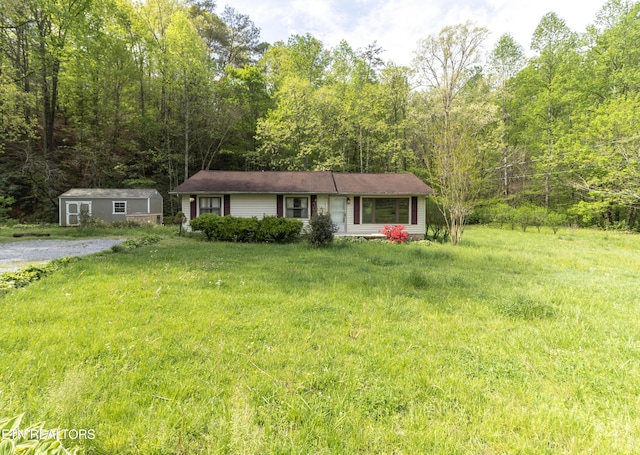 3398 Bell Rd, Sevierville, TN 37862 - single story home featuring a front yard and a forest view